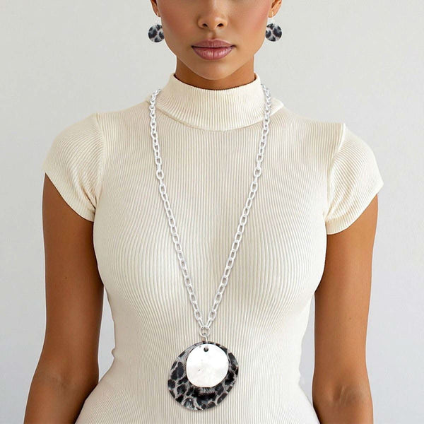 Long leopard print pendant necklace set with matching earrings, featuring silver chain and acrylic designs.